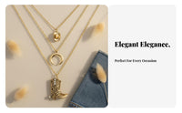 Boho necklace with boots, ox head, crescent charms.